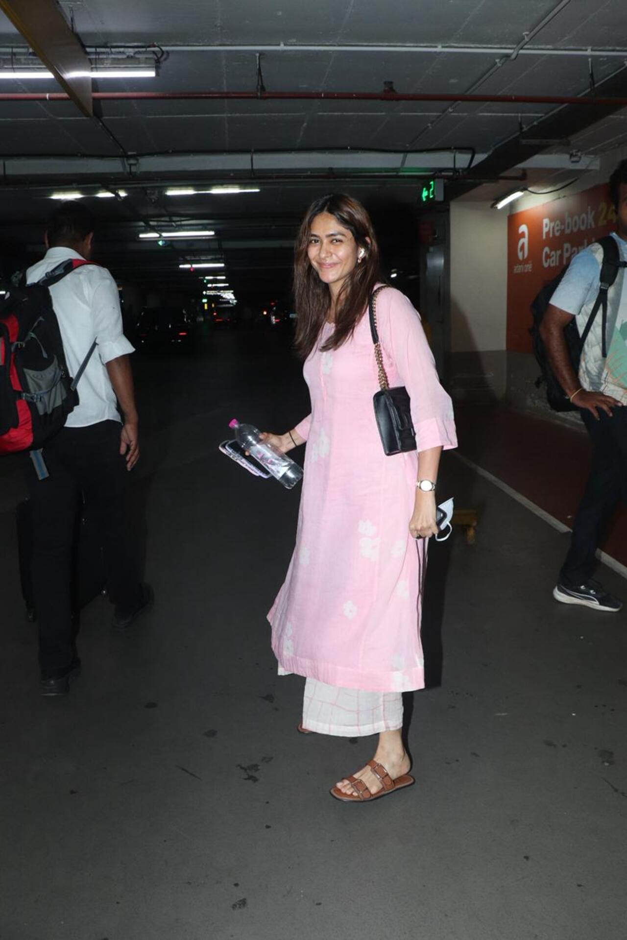 Actress Mrunal Thakur was spotted at the airport in a light pink and white ethnic wear. She was all smiles as she was heading for promotions of Son Of Sardaar 2. 